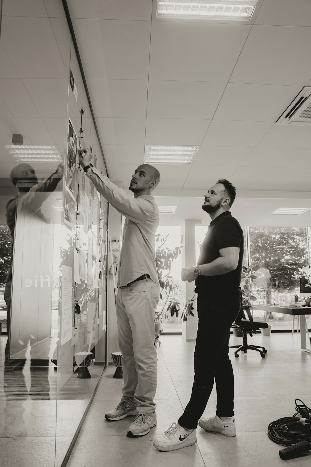 A couple of men standing next to each other
